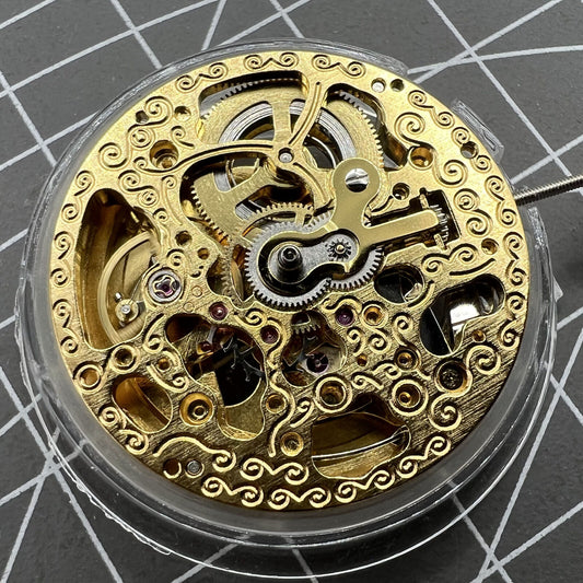 Hangzhou 2189 automatic watch movement with golden 3-hand skeleton design for precise timekeeping.