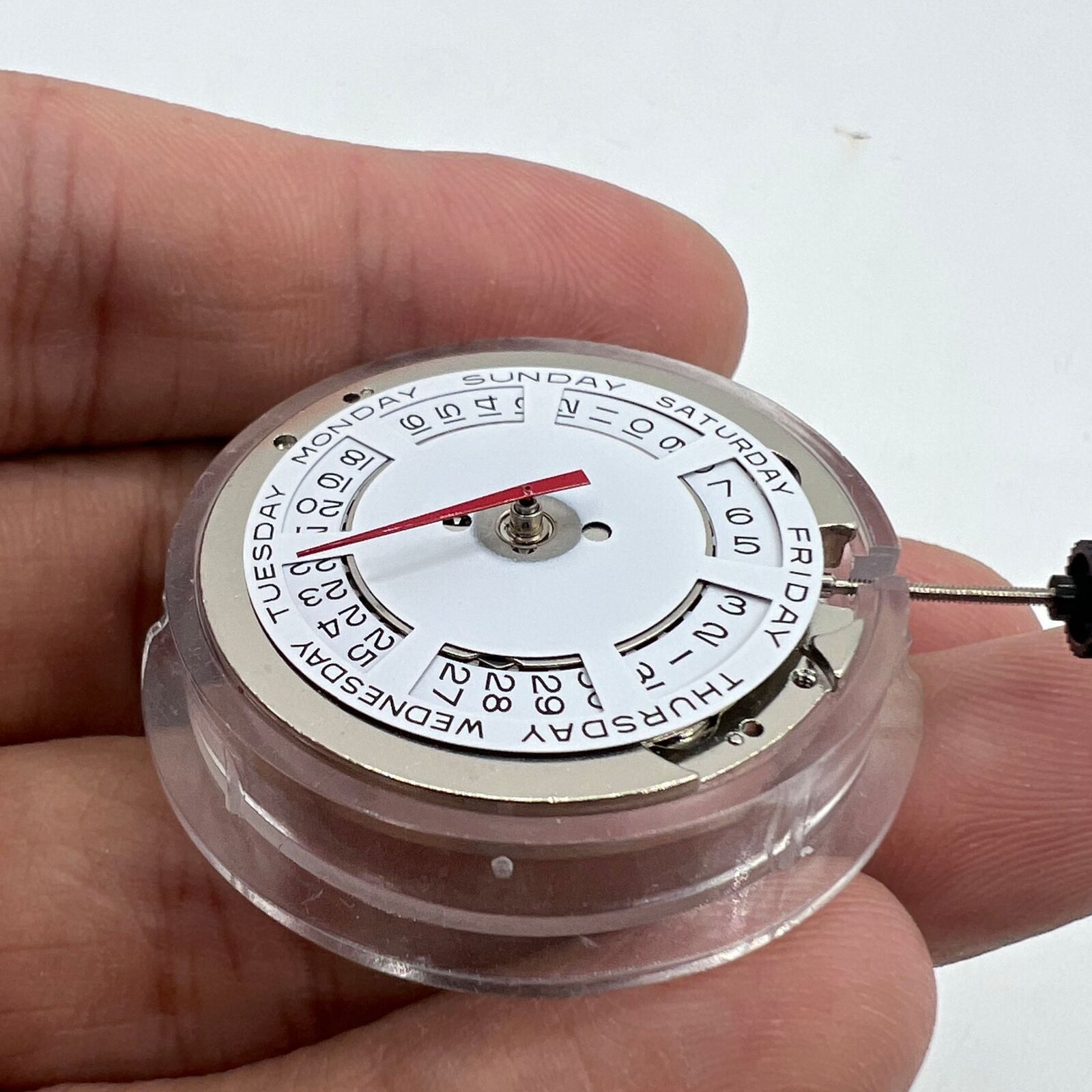 ST2147 automatic mechanical watch showing day at 12 o'clock and date at 3 o'clock, precise timekeeping.