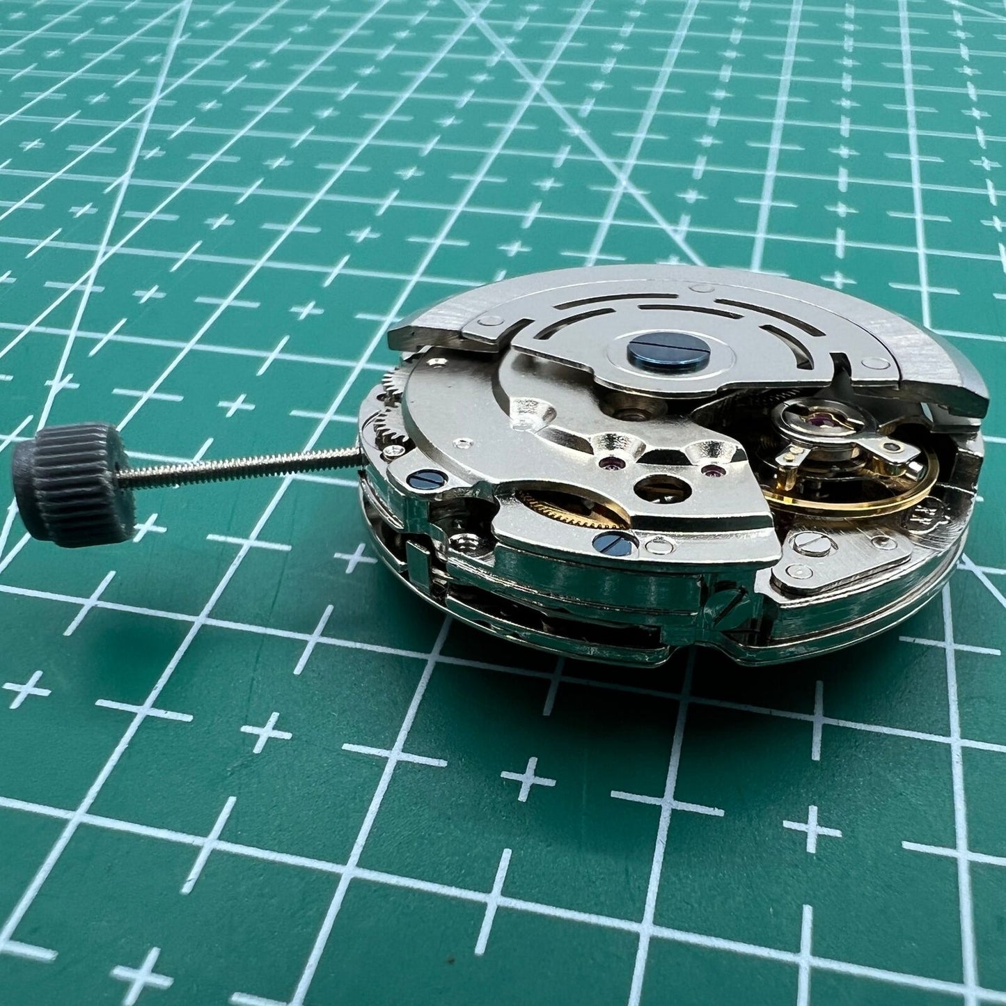 DG2813 mechanical watch movement showing three large hands and small seconds subdial at 6 o?clock, no calendar.