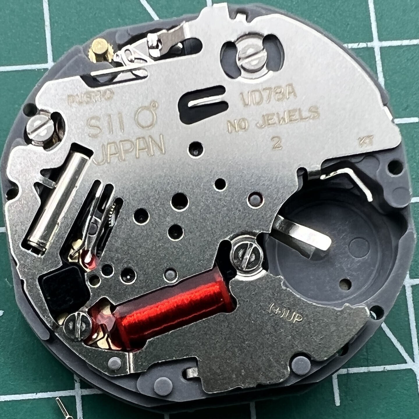 Hattori Epson VD78A quartz watch movement showcasing precise Japan-made mechanism for accurate timekeeping.