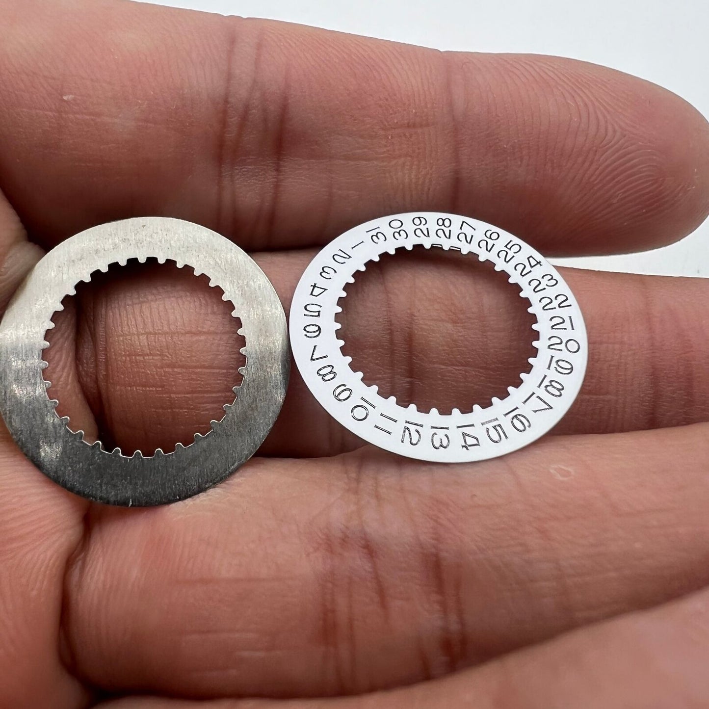 White date disk wheel for RLX 3235 movement, precision Rolex replacement part for accurate date display.