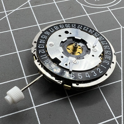Golden ISA 8271 quartz watch movement with multifunctional date display positioned at 6 o'clock.