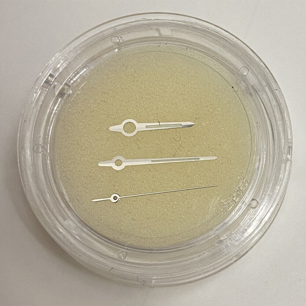 Golden luminous watch hands for ETA 2892 movement, enhancing low-light visibility in watch repair.  