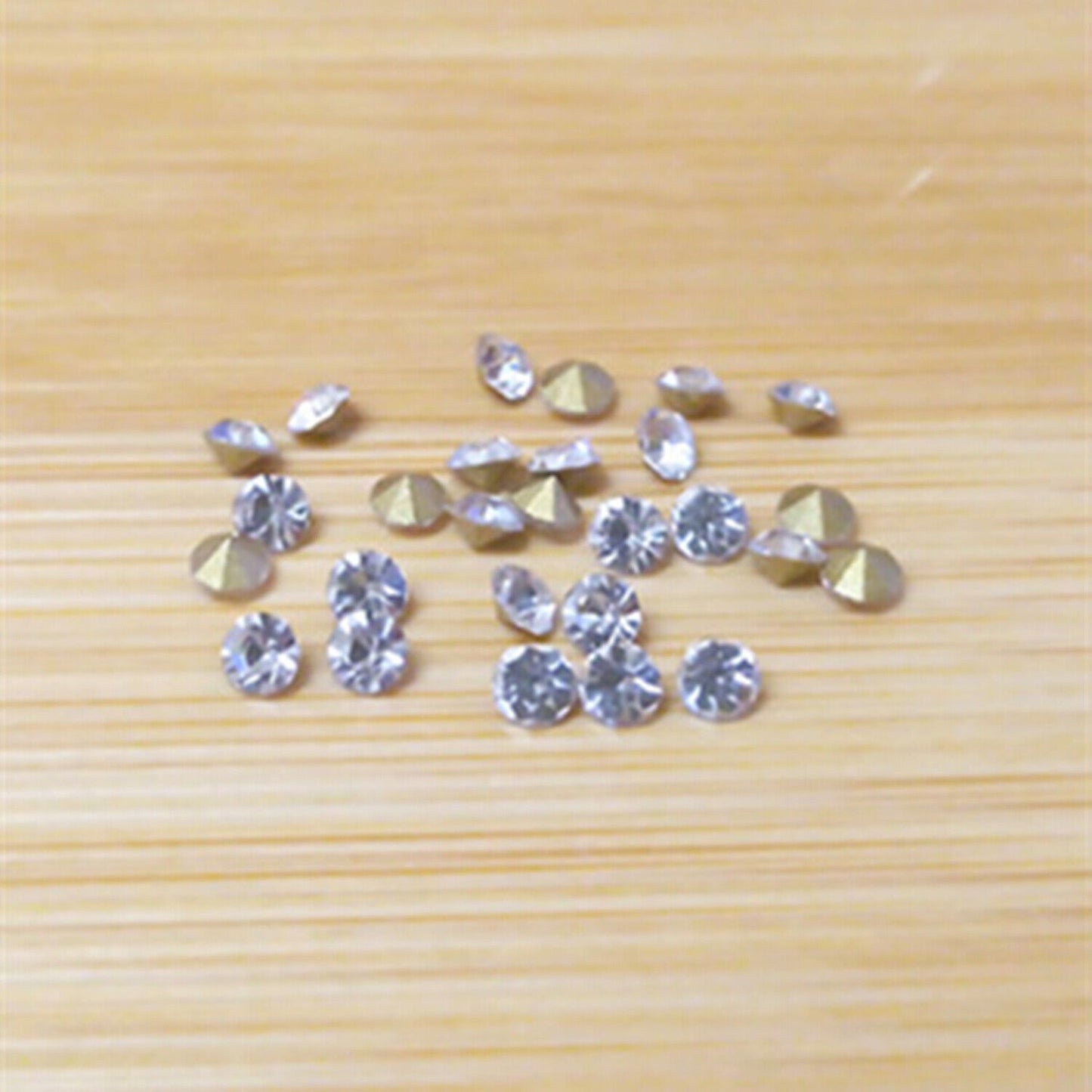 Assorted 18 size imitation diamond set with pointed bottoms for stylish watch customization.