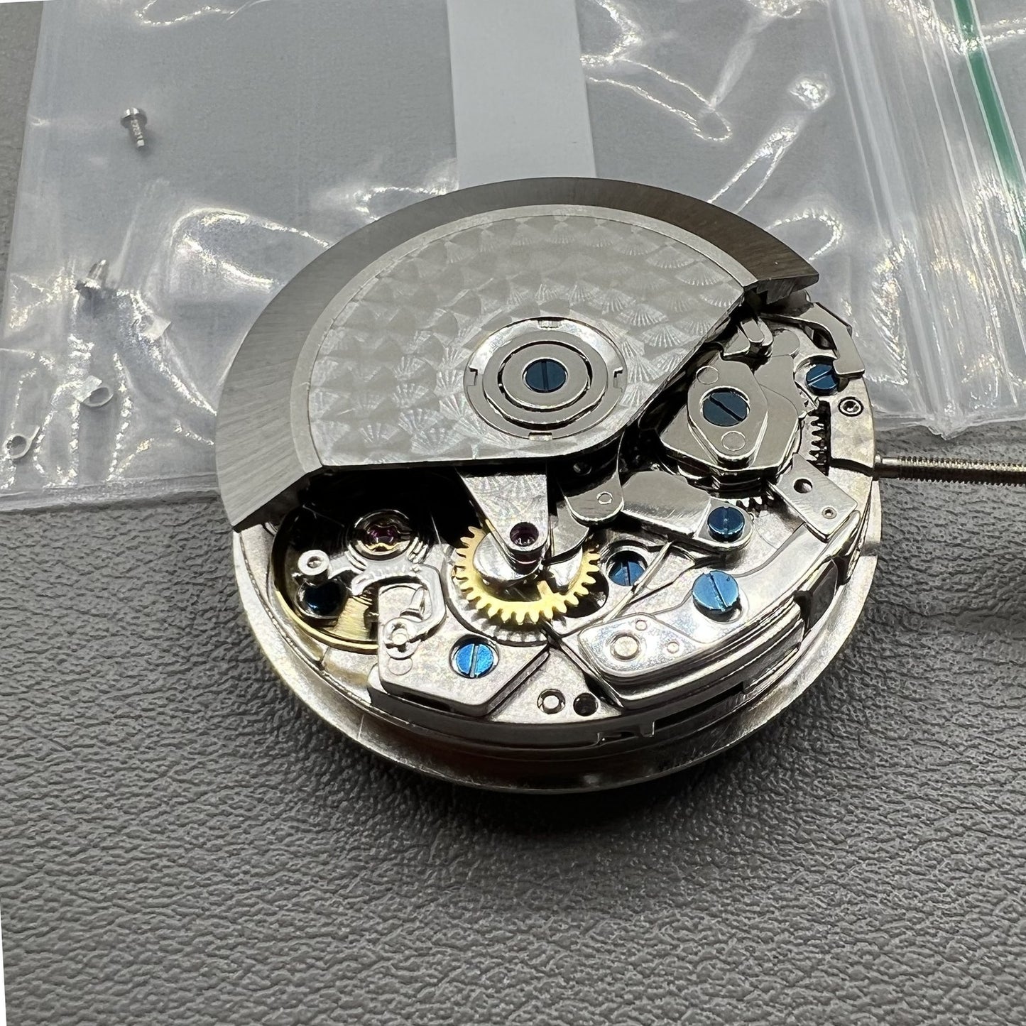 Chronograph watch accessory with ETA 7750 movement, white dial, calendar at 6, second hand at 9.