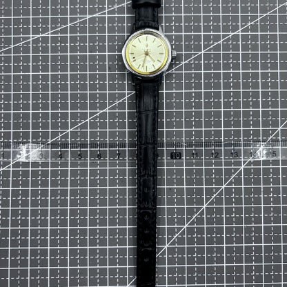 27mm Kongque watch with black leather strap, silver dial, gold hour markers, manual mechanical movement, 19 jewels.