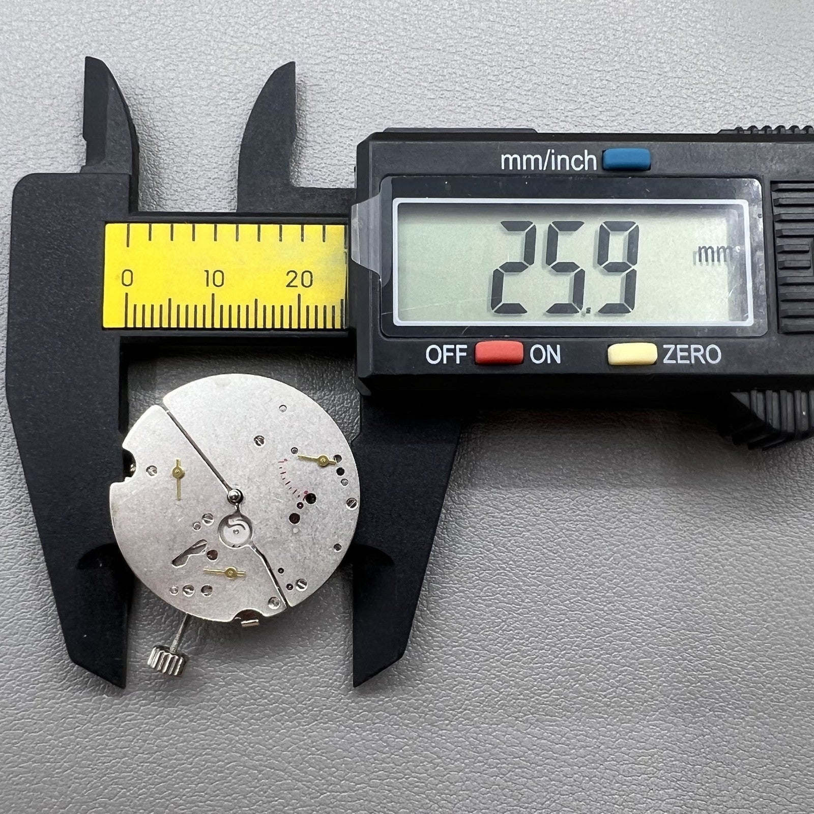 Tianjin ST17 T17 hand-wound watch movement with two hands and power reserve indicator at 10 o'clock.