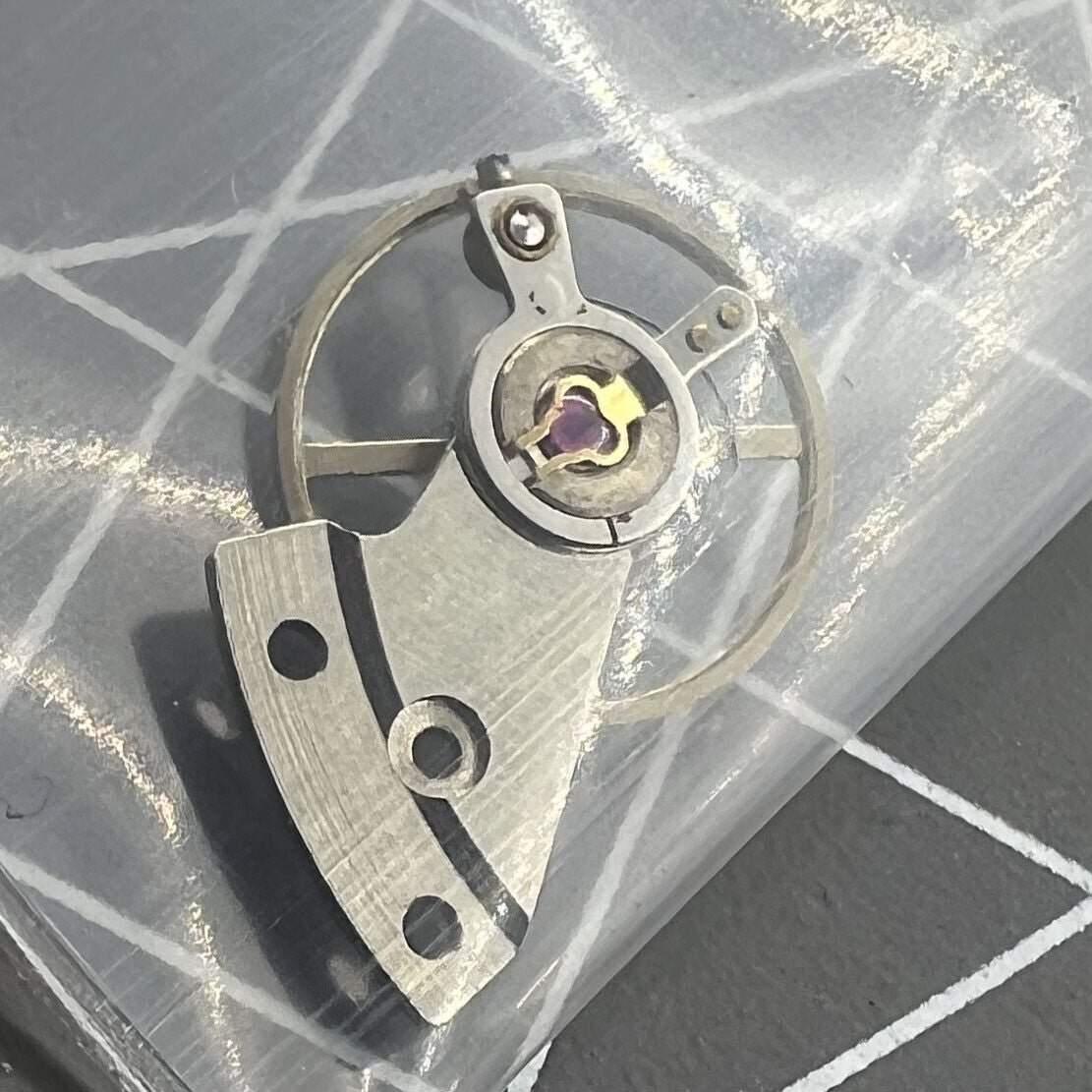 Complete balance wheel with splint for Mingzhu 2813 8205 watch movement, precision repair part by Mingzhu, essential for accurate timekeeping adjustments.