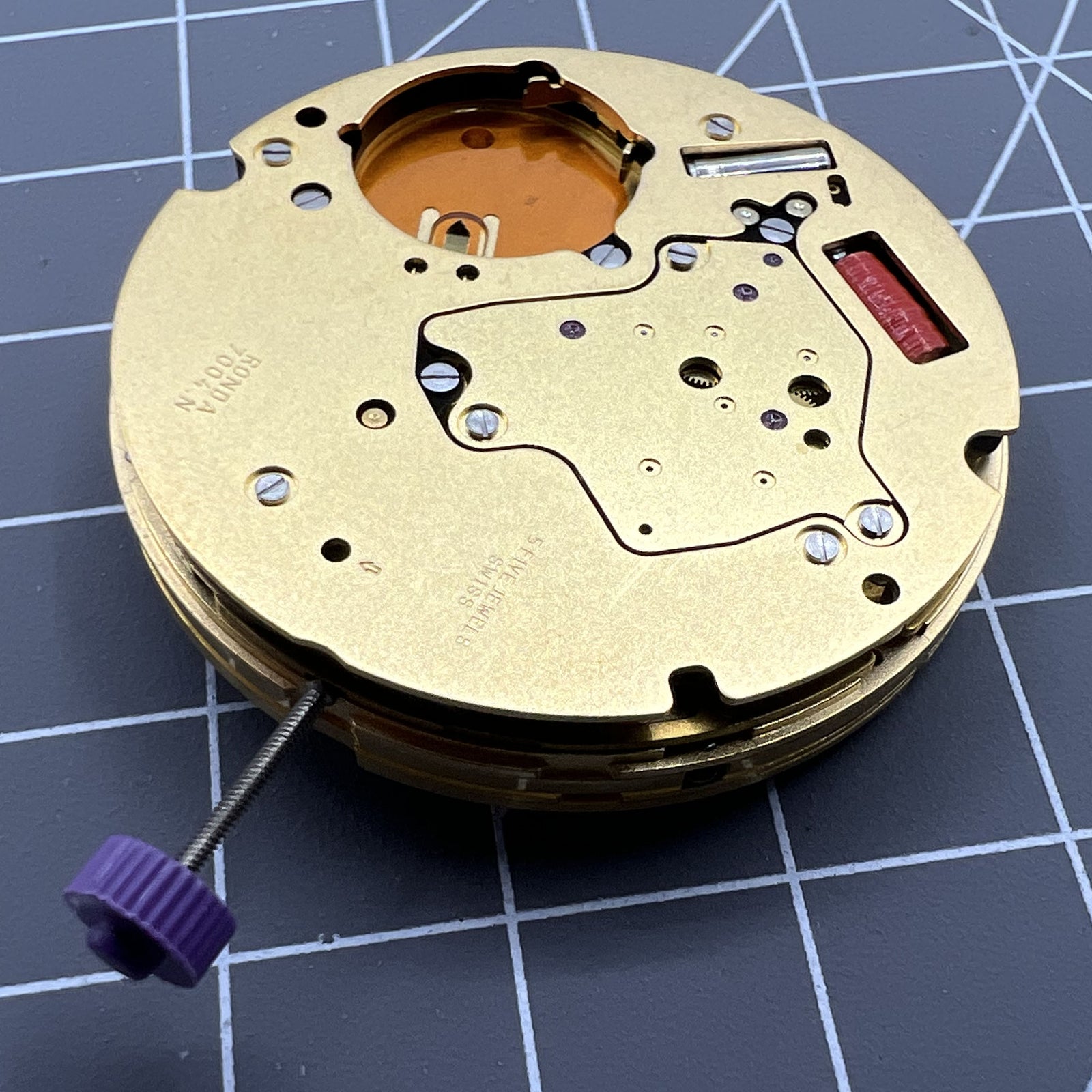 Swiss Made Ronda 7004N quartz watch movement, precise mechanism for reliable timekeeping accessories.