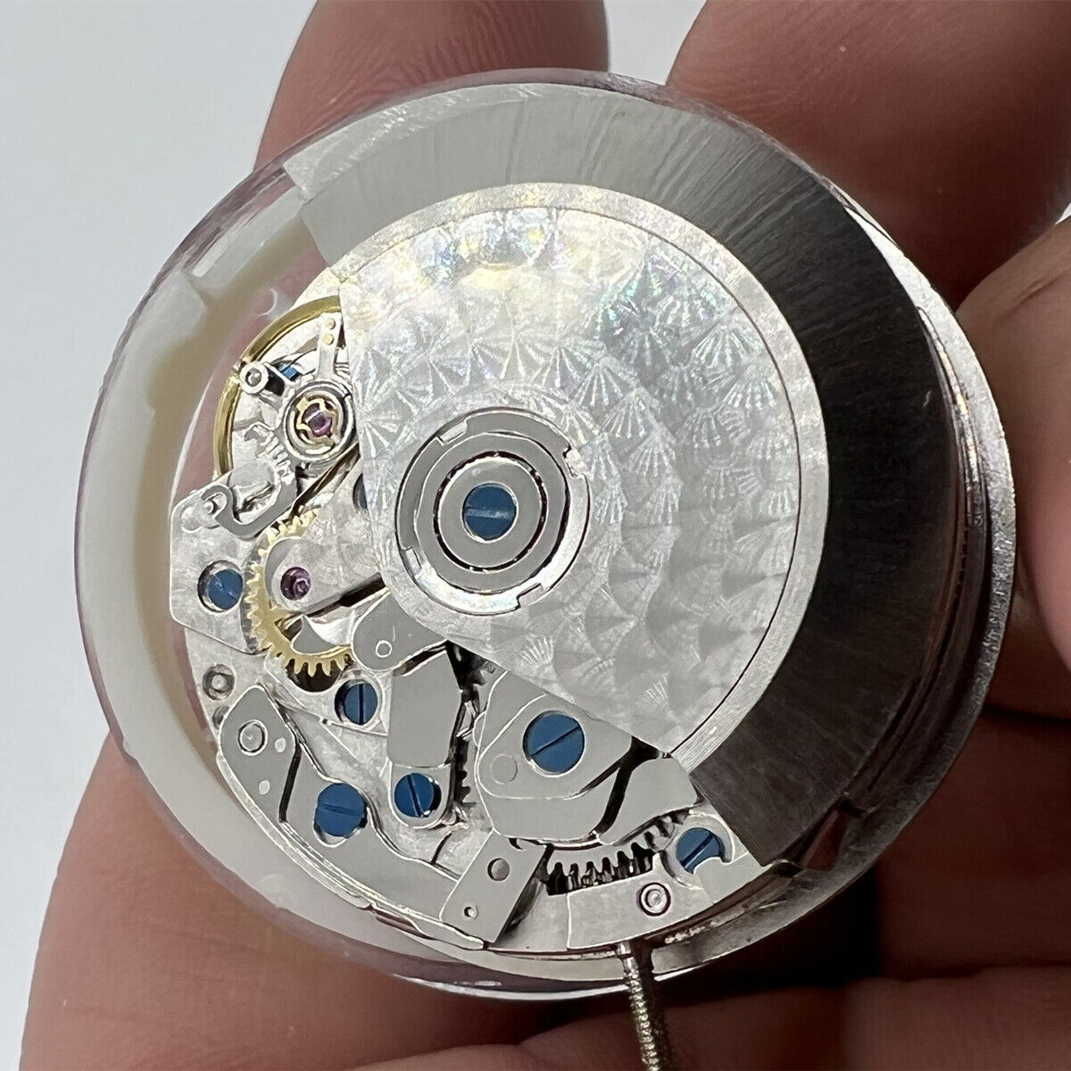 China-made 7750 mechanical watch movement with white dial and single calendar, featuring small seconds at 3, 6, and 9 o'clock positions.