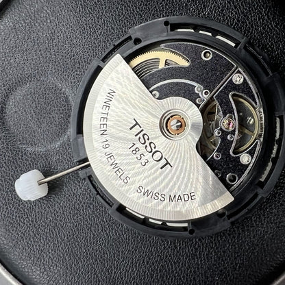 Swiss Made Tissot ETA C15.111 chronograph watch movement with white dial for accurate timekeeping.