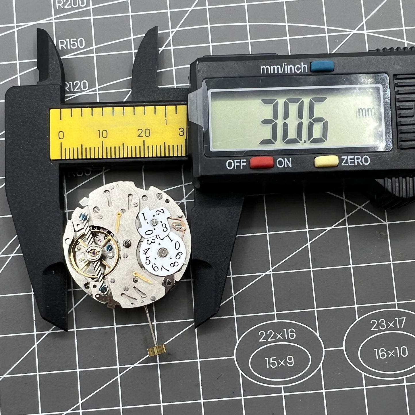 Automatic mechanical watch featuring reversed balance wheel and large date display at 12 o'clock.