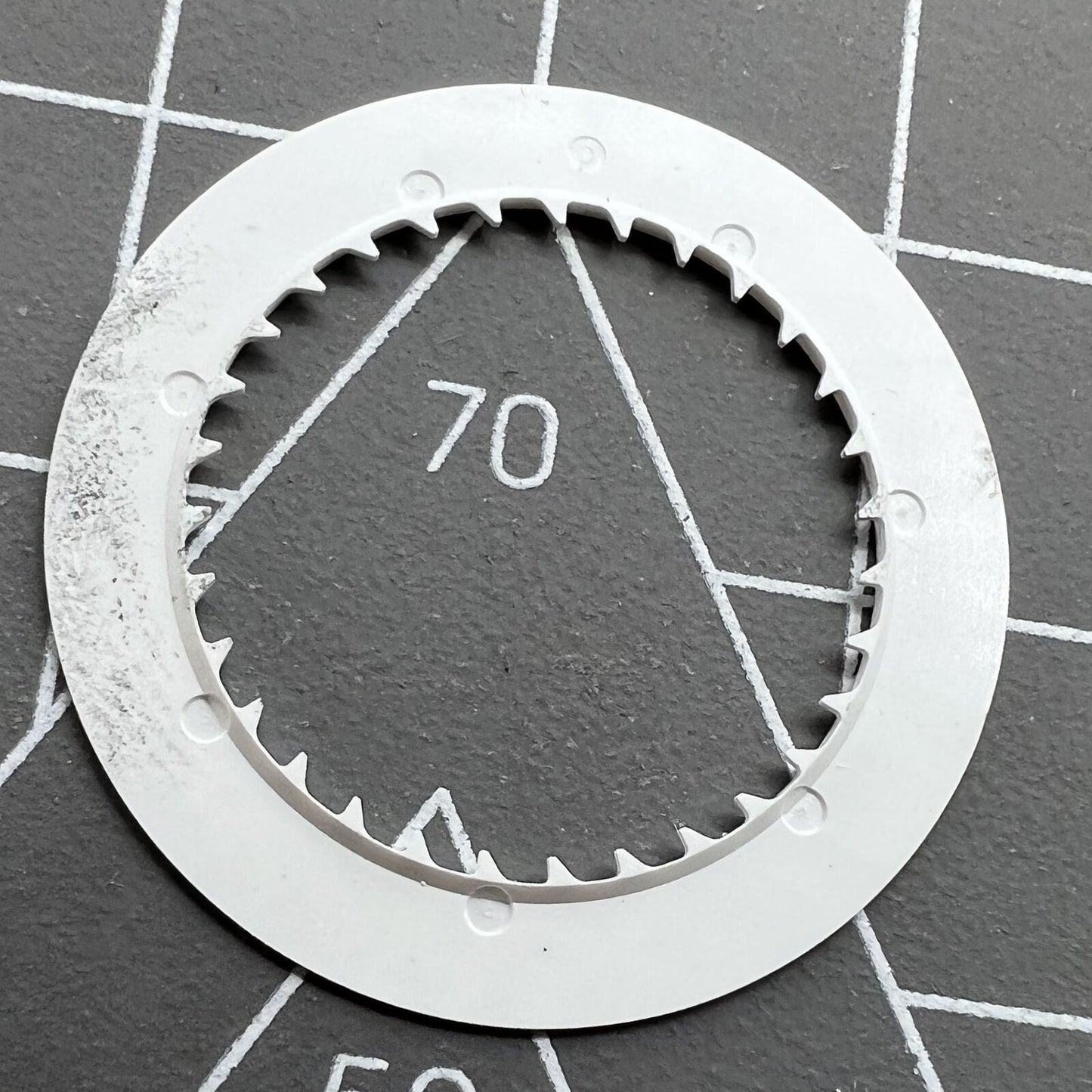 NH35 watch date wheel with vibrant orange font on white background, perfect for automatic watch replacements.