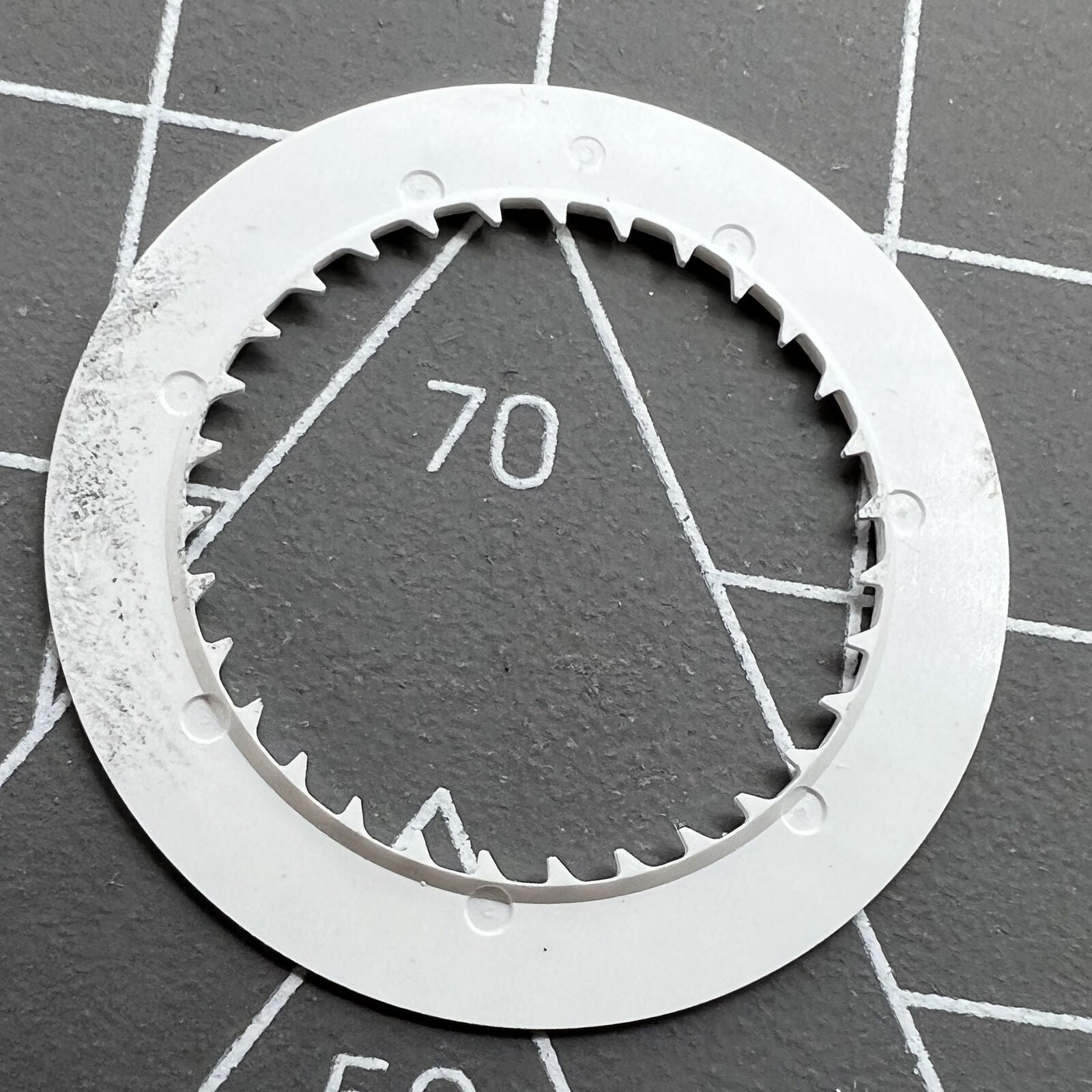 NH35 watch date wheel with vibrant orange font on white background, perfect for automatic watch replacements.