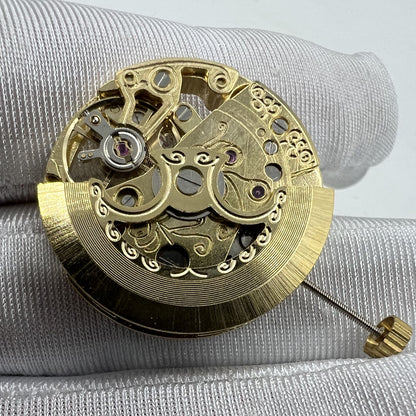 Golden 26.5mm 7120 automatic watch movement with carved hollow design, ideal for watch accessories.
