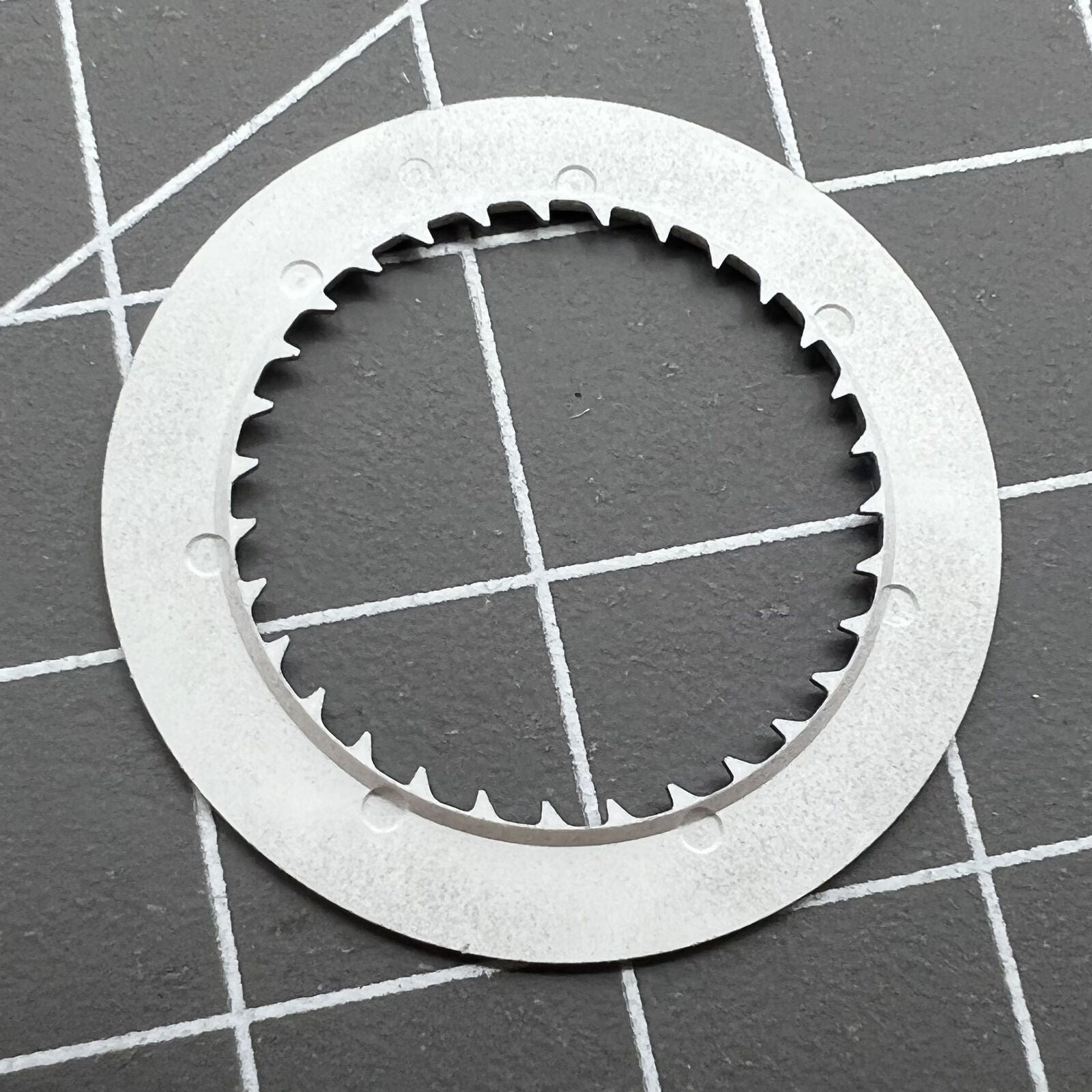 Golden date wheel for NH35 NH36 watch movements, contrasting black background detail.