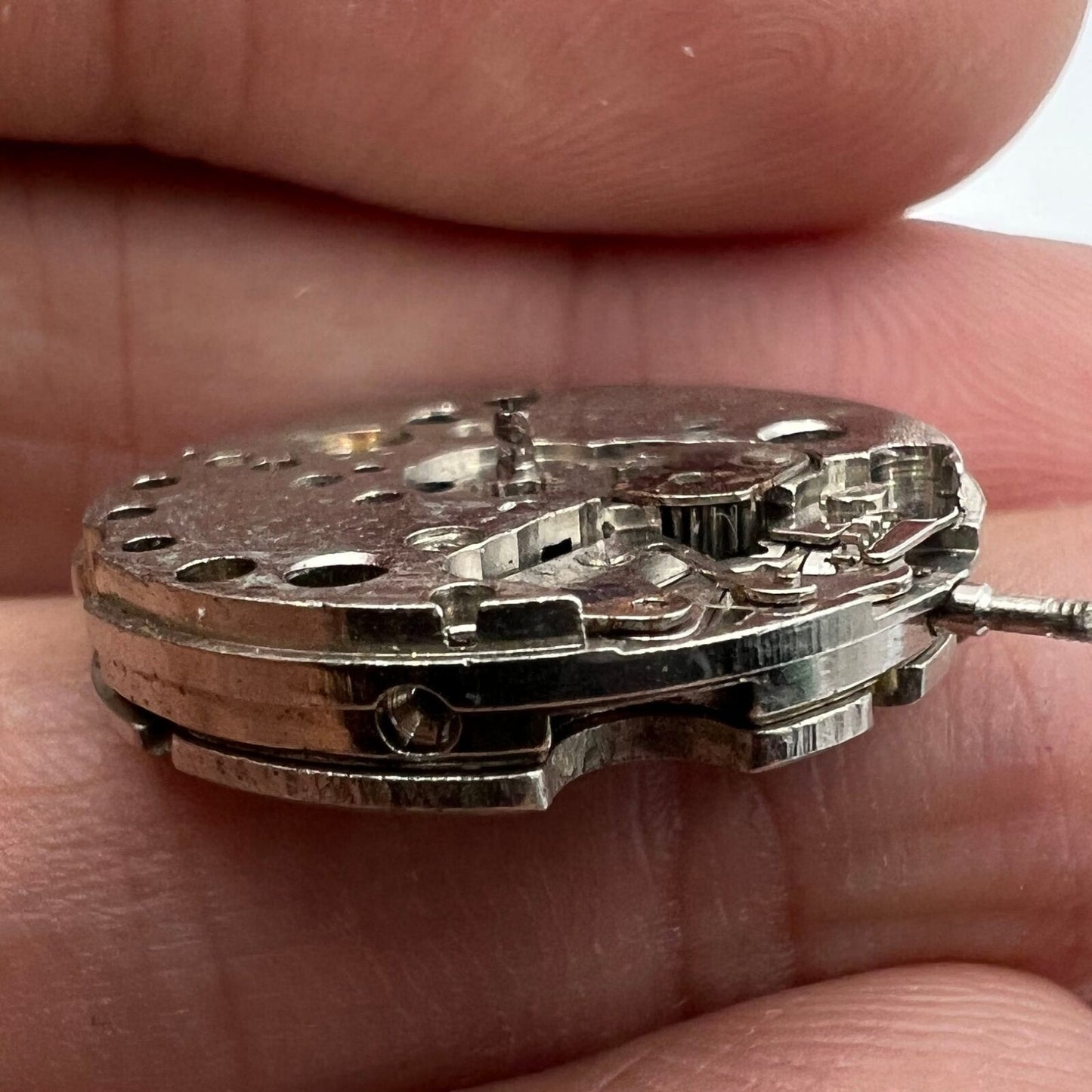 Close-up of China Made 7121 3121 automatic mechanical watch movement for repair practice.