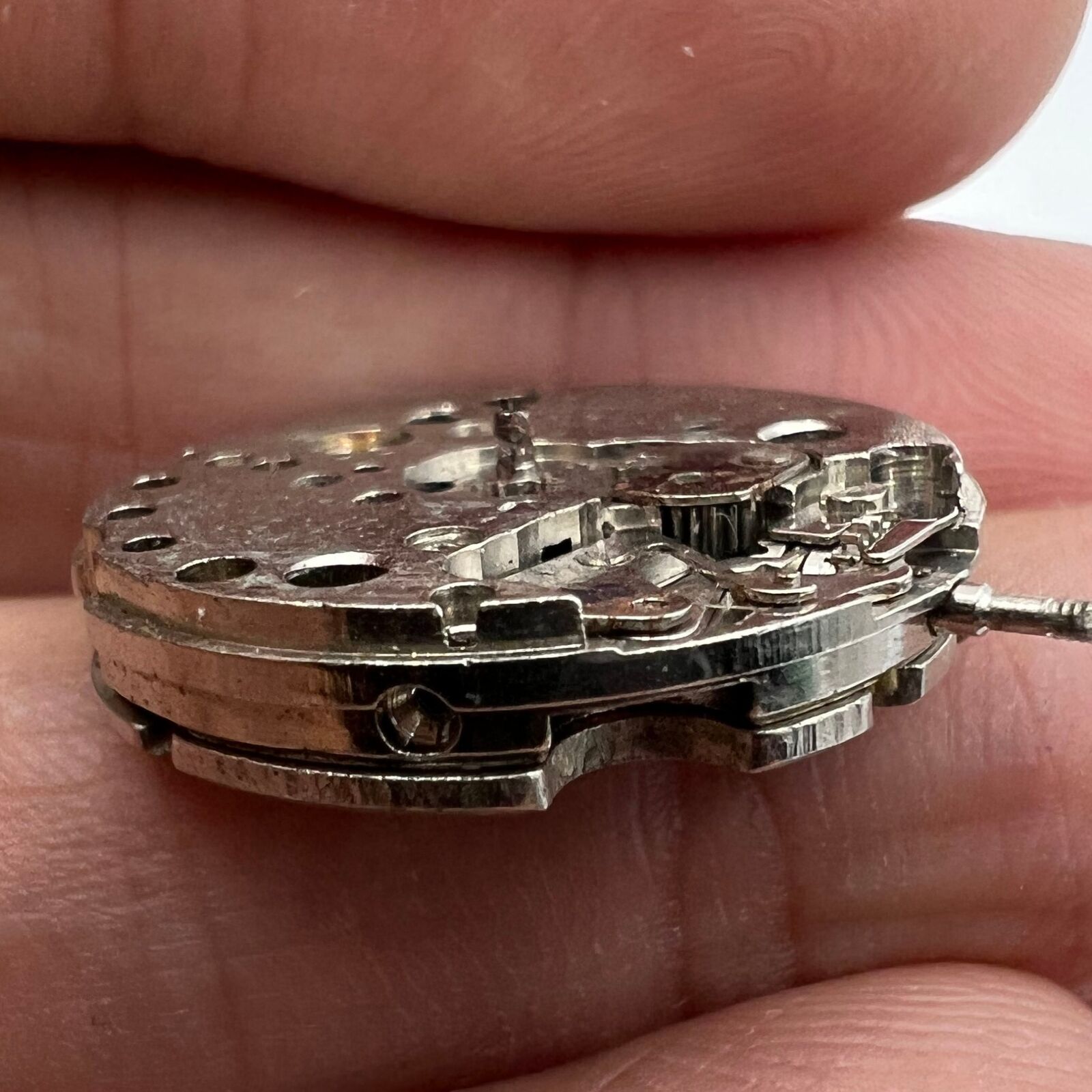 Close-up of China Made 7121 3121 automatic mechanical watch movement for repair practice.