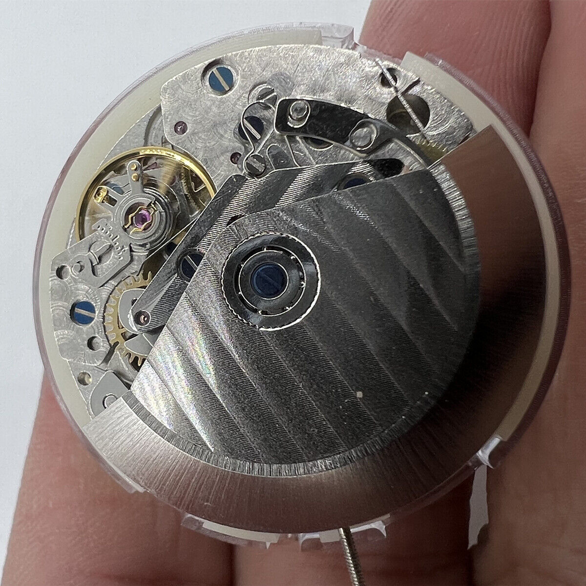 Asian 7750 automatic chronograph movement showing day-date at 3 o'clock, precise ETA 7750 design.