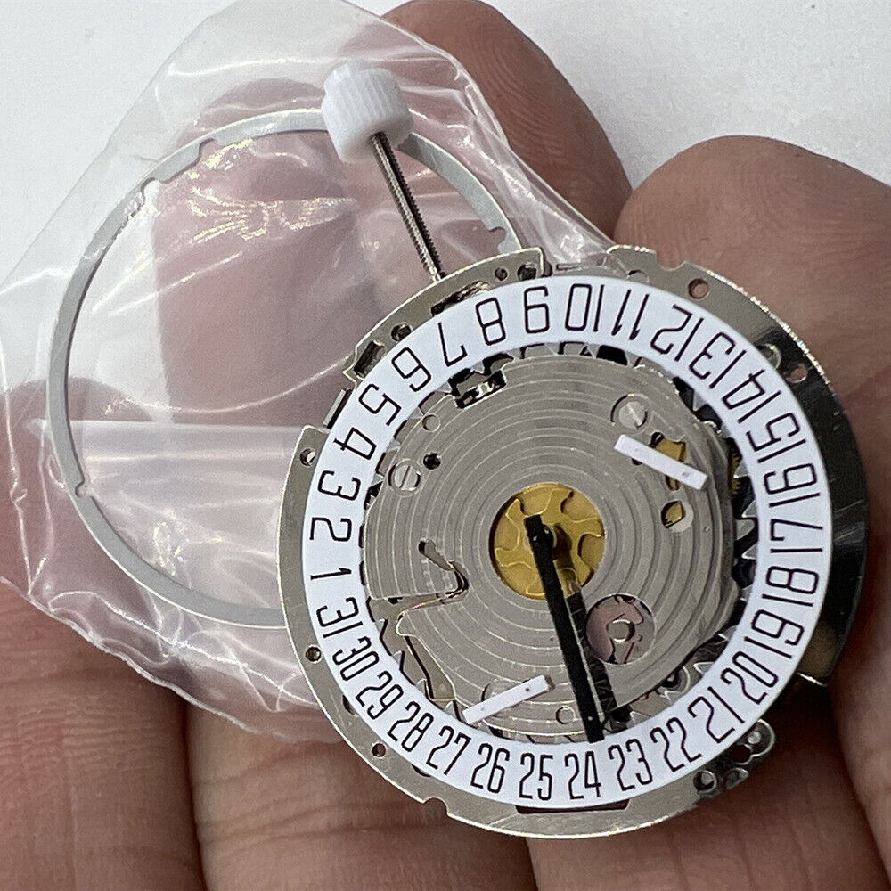 ISA 8171 silver quartz watch movement with date at 6, multi-function repair part for precision timepieces.