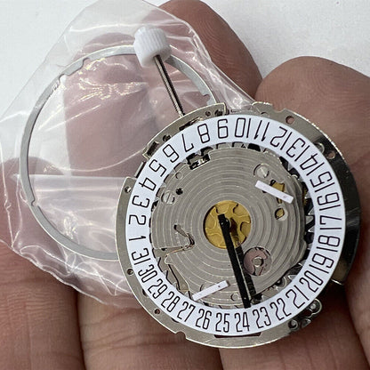 ISA 8171 silver quartz watch movement with date at 6, multi-function repair part for precision timepieces.