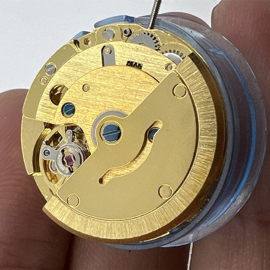 Golden TianJing DG2813 automatic mechanical watch movement showing day and date display, precision craftsmanship.
