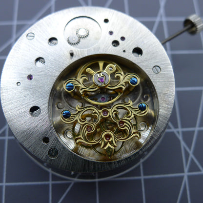 Multifunctional automatic mechanical watch featuring kinetic tourbillon for precision and style.
