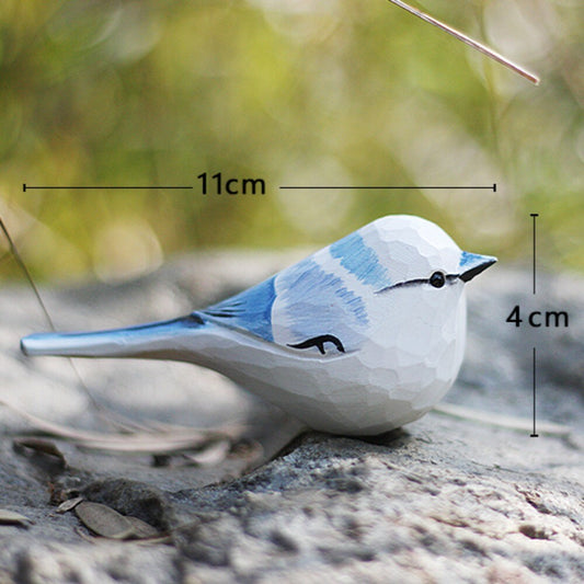 Handmade Blue Tit wooden figurine, detailed bird sculpture for unique home decor and collectibles.