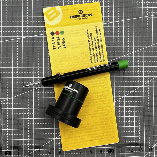 Swiss Tool Bergeon 7720-5 automatic watch oiler for precise clock maintenance and repair.