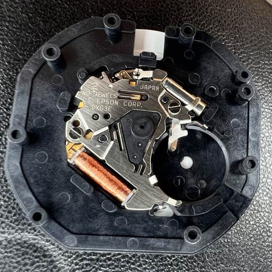 Hattori Epson TMI VX63E quartz watch movement, precision Japan-made mechanism for accurate timekeeping.