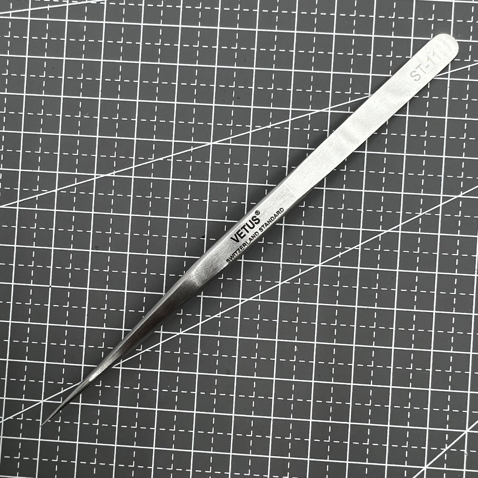 ST11 Superhard Antimagnetic Tweezer by Edelstahl, precision tool for watch repair and delicate accessory handling.