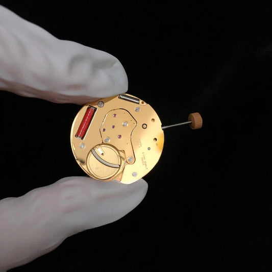Gold gilted RONDA 6004B Swiss quartz watch movement for precise timekeeping.