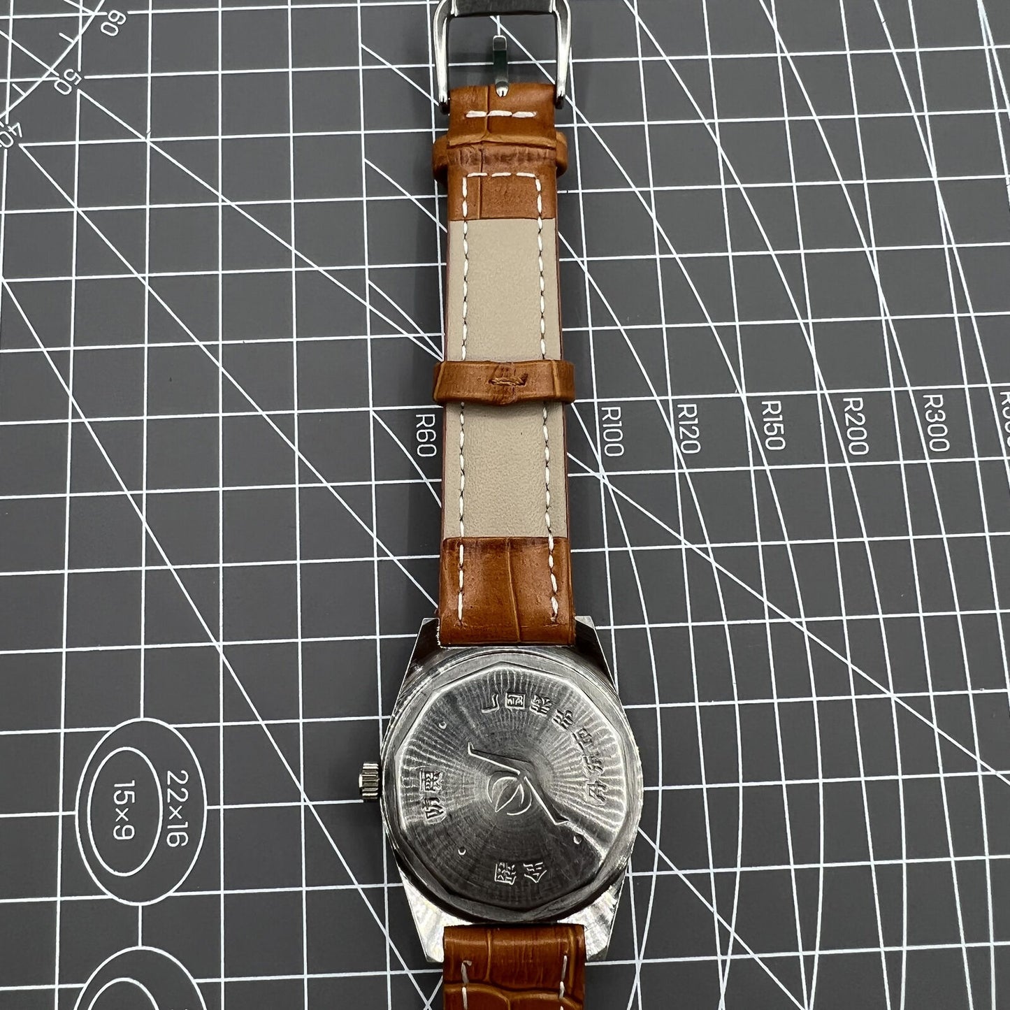 33mm Chunlan manual steel watch with silver dial, 17-jewel movement, and sleek black leather band.