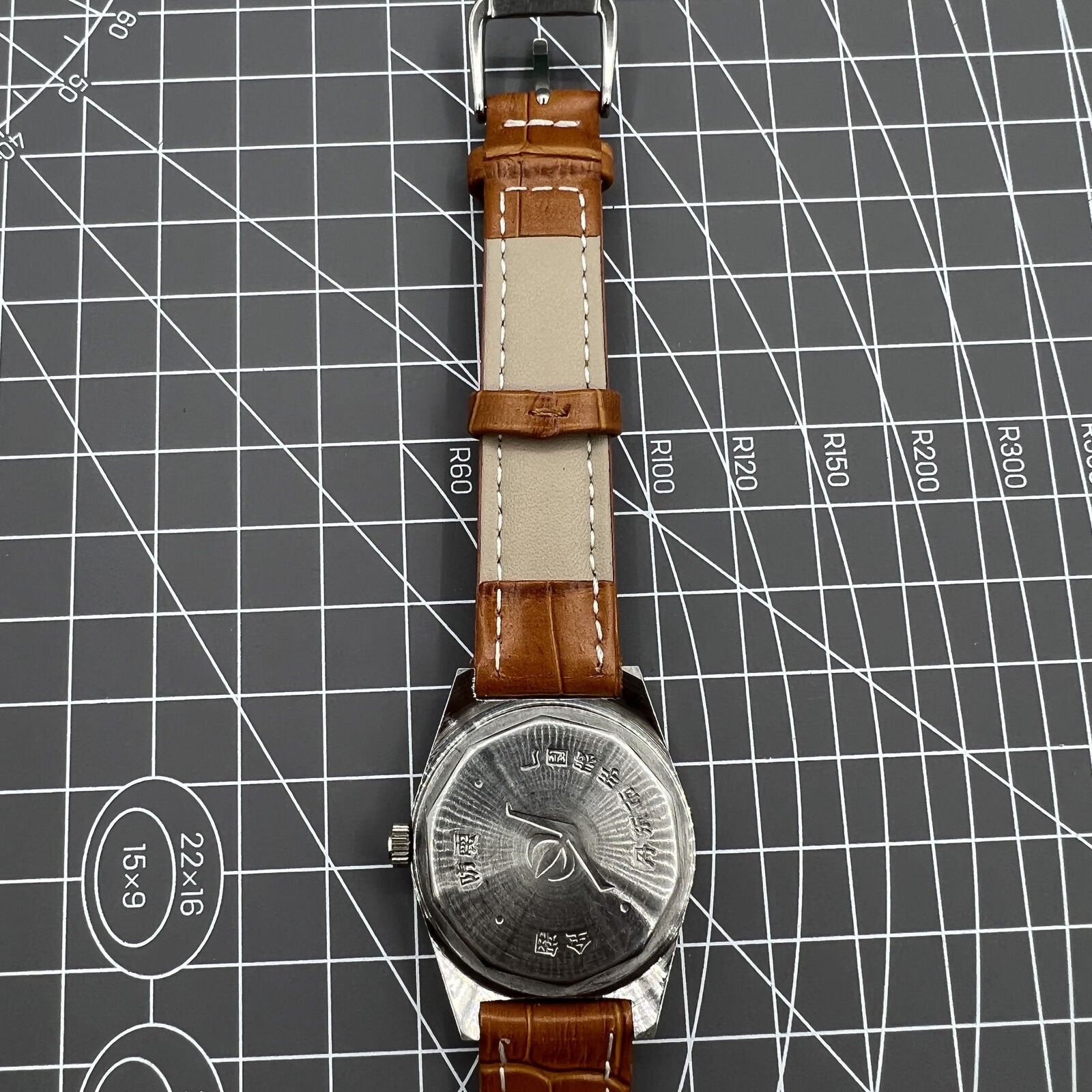 33mm Chunlan manual steel watch with silver dial, 17-jewel movement, and sleek black leather band.