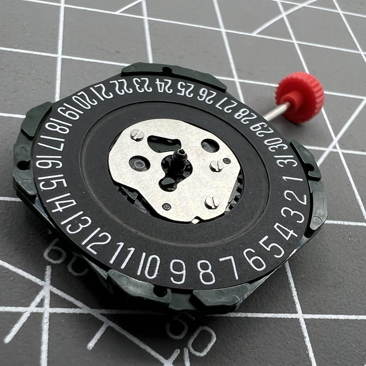 Black dial watch with Miyota 2315 quartz movement, 3 hands, date at 6, compatible stem, by Miyota.