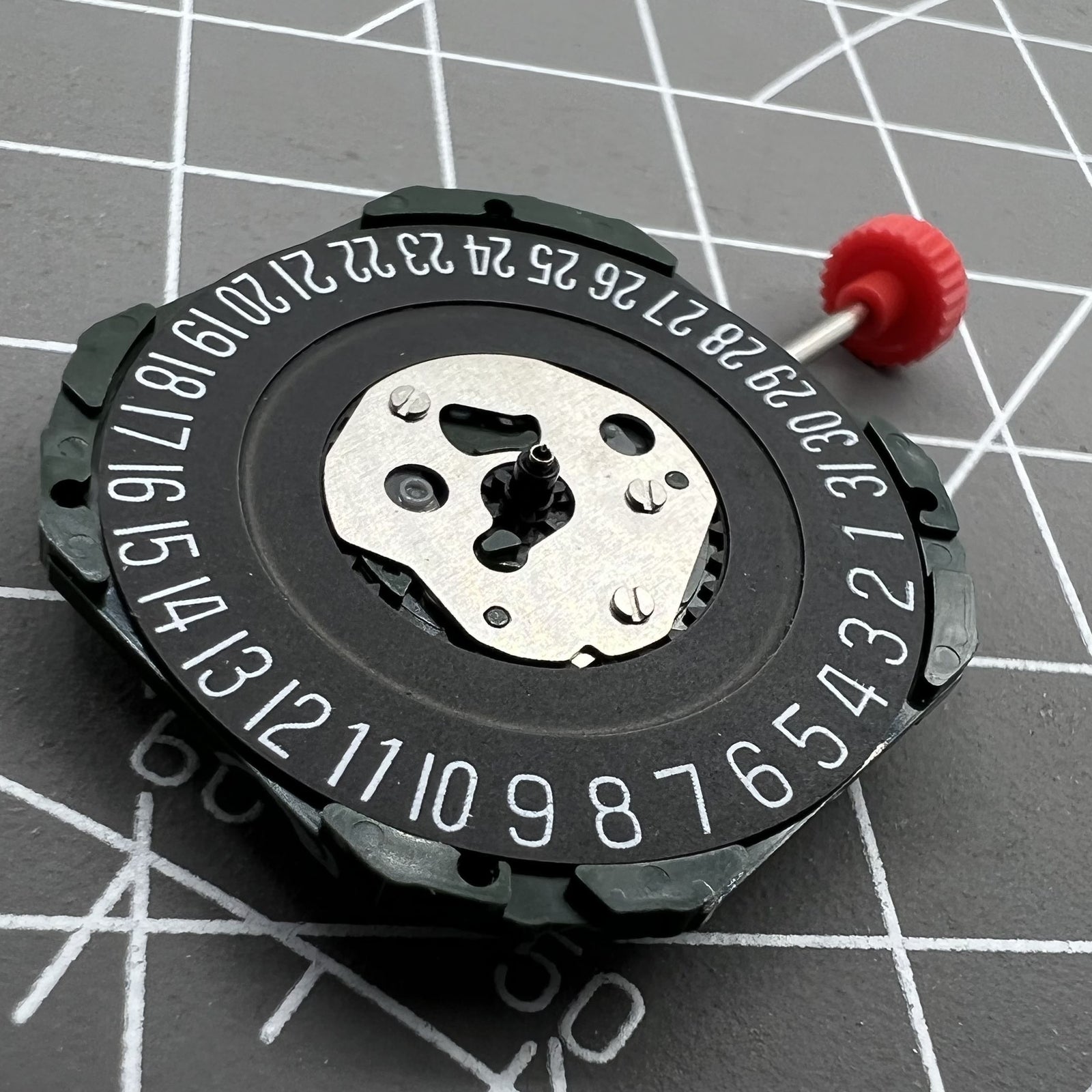 Black dial watch with Miyota 2315 quartz movement, 3 hands, date at 6, compatible stem, by Miyota.