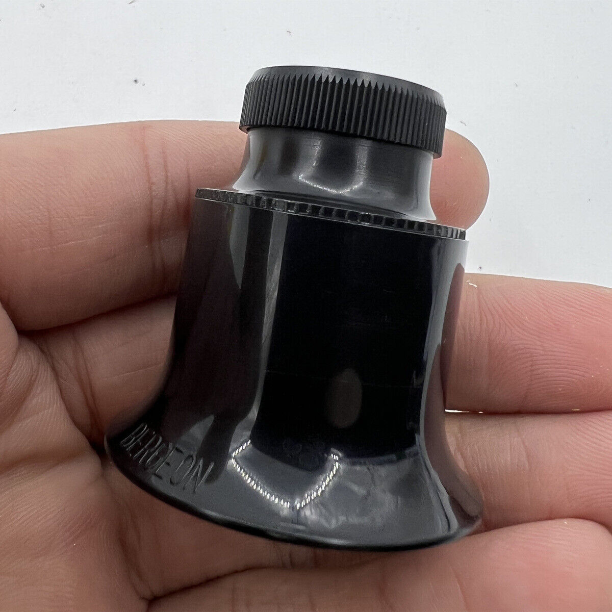 Bergeon 1458A-12 double lens eyeglass with 12x magnification for detailed watch repair and assembly.