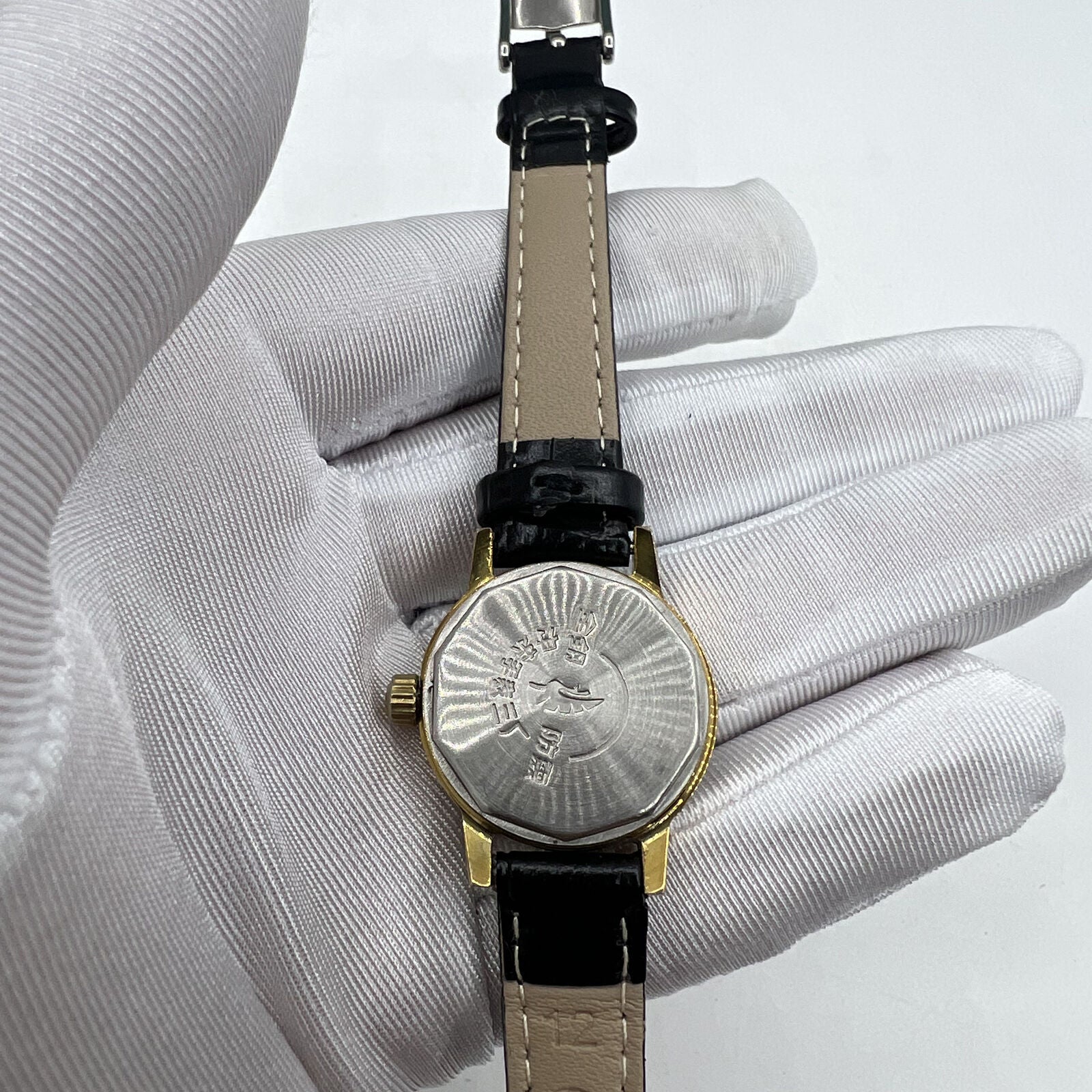 27mm Kongque silver dial watch with golden markers, 19-jewel manual mechanical movement, elegant China-made timepiece.