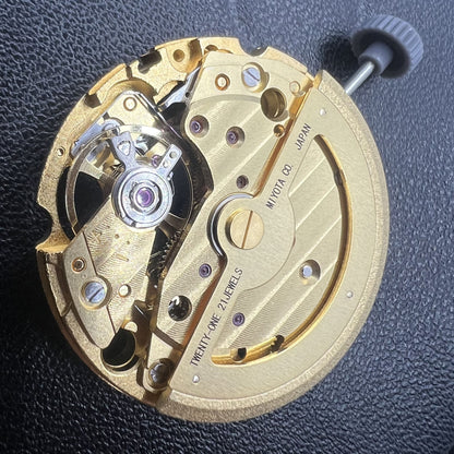 Miyota/Citizen 82S5 golden plated automatic watch movement for accurate mechanical timekeeping.