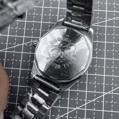 32mm HONGLIAN manual silver watch with 17 jewels, Roman numeral dial, elegant classic design.