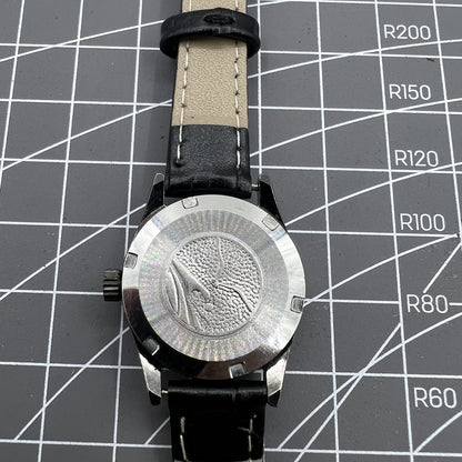 Seagull black case ladies watch with gold nail markers, manual mechanical movement, and shock resistance.