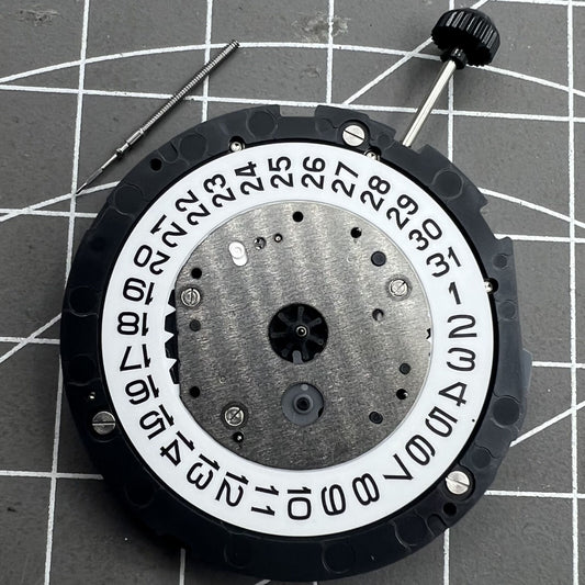 Miyota 6S20 quartz watch movement with date at 3, three hands, small seconds at 6 and 9, precision timekeeping.