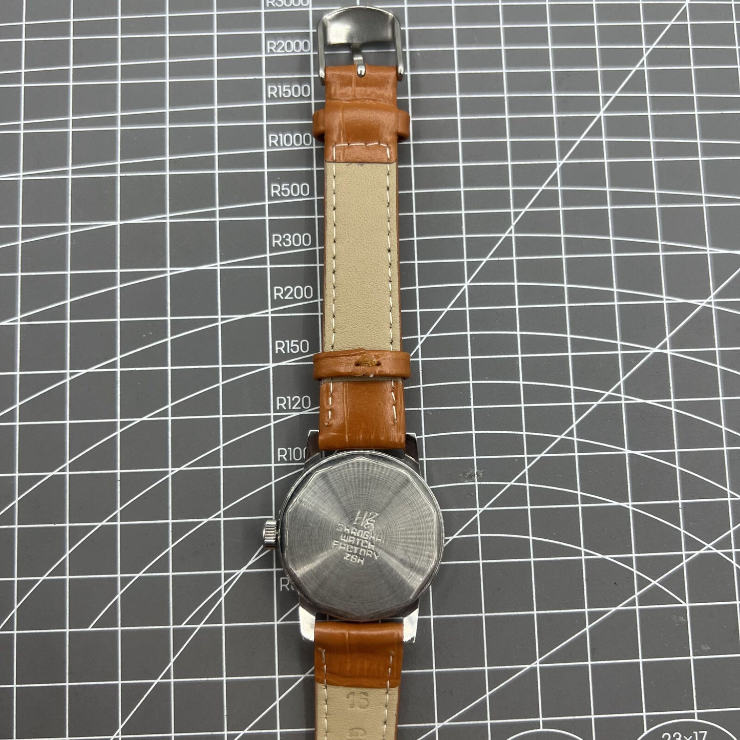 Shanghai Factory 32mm manual mechanical watch with silver case and hour markers, classic elegant design for everyday wear.