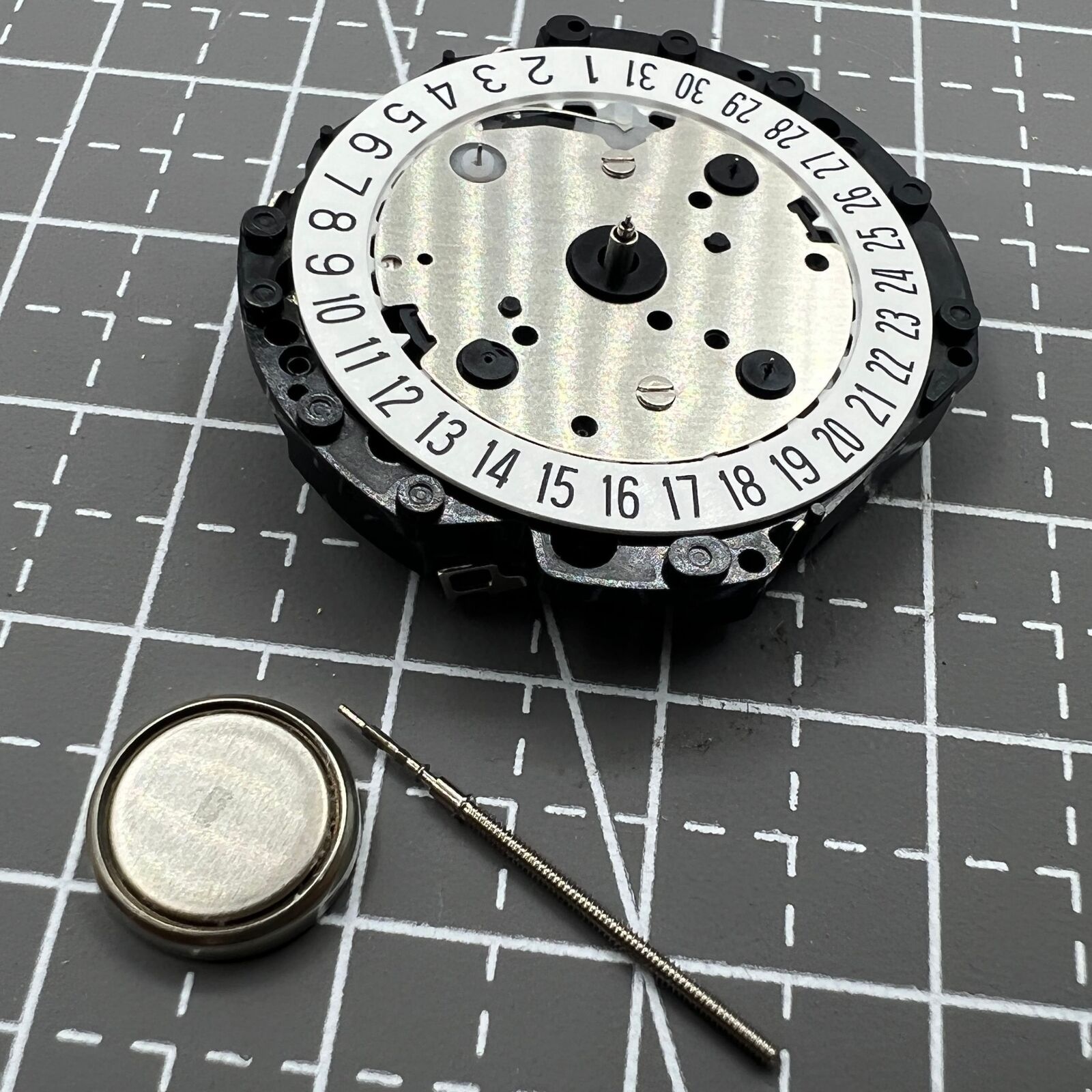 Hattori Epson VD53C quartz watch movement with date at 6, Japan-made precision part for repairs.