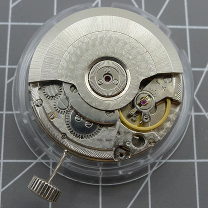 Black Seagull ST2555 automatic watch movement showing second hand at 9H, perlage finish, and big date display.