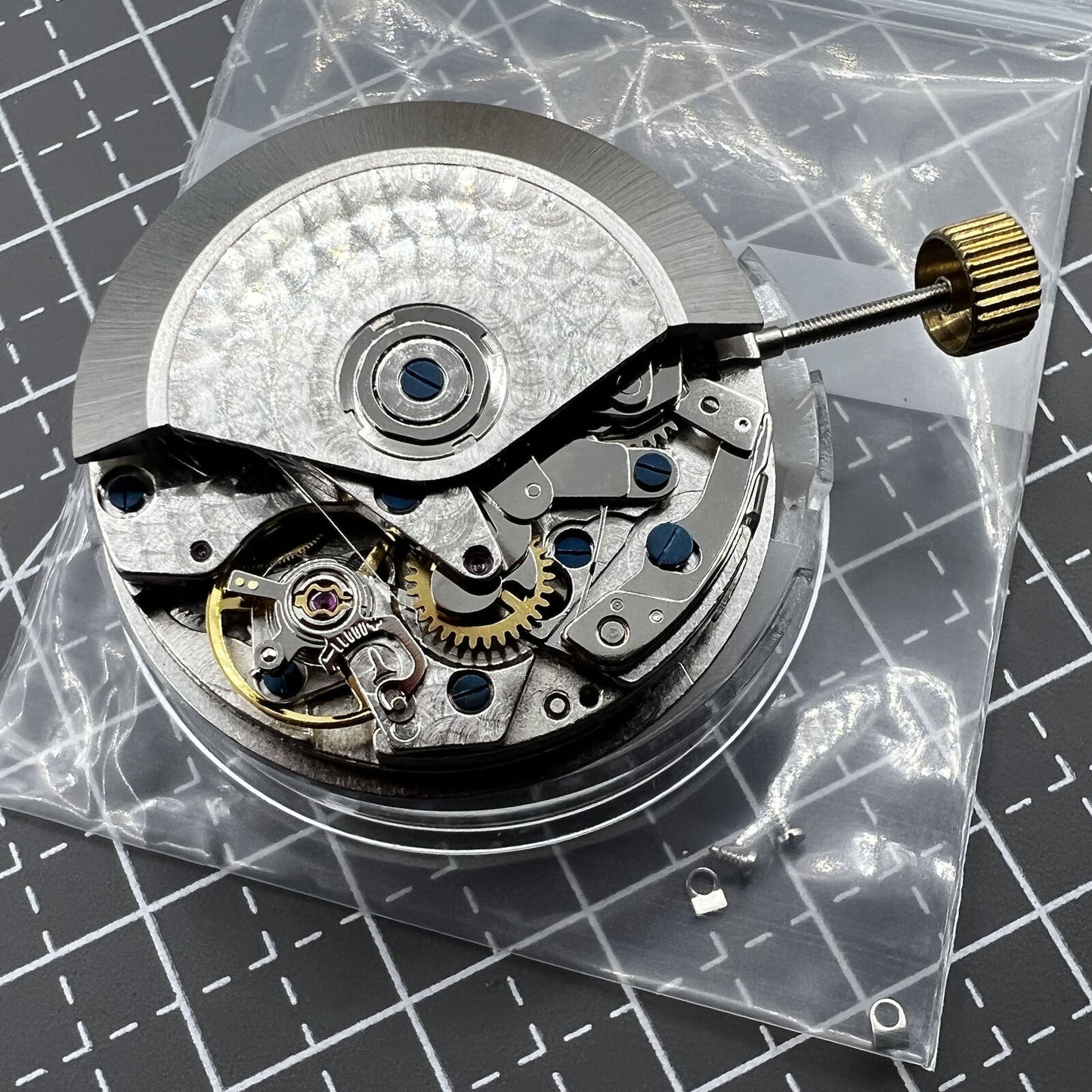 7750 black dial chronograph watch with three hands, small second at 9 o'clock, and day-date display for precision timekeeping.