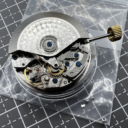 7750 black dial chronograph watch with three hands, small second at 9 o'clock, and day-date display for precision timekeeping.