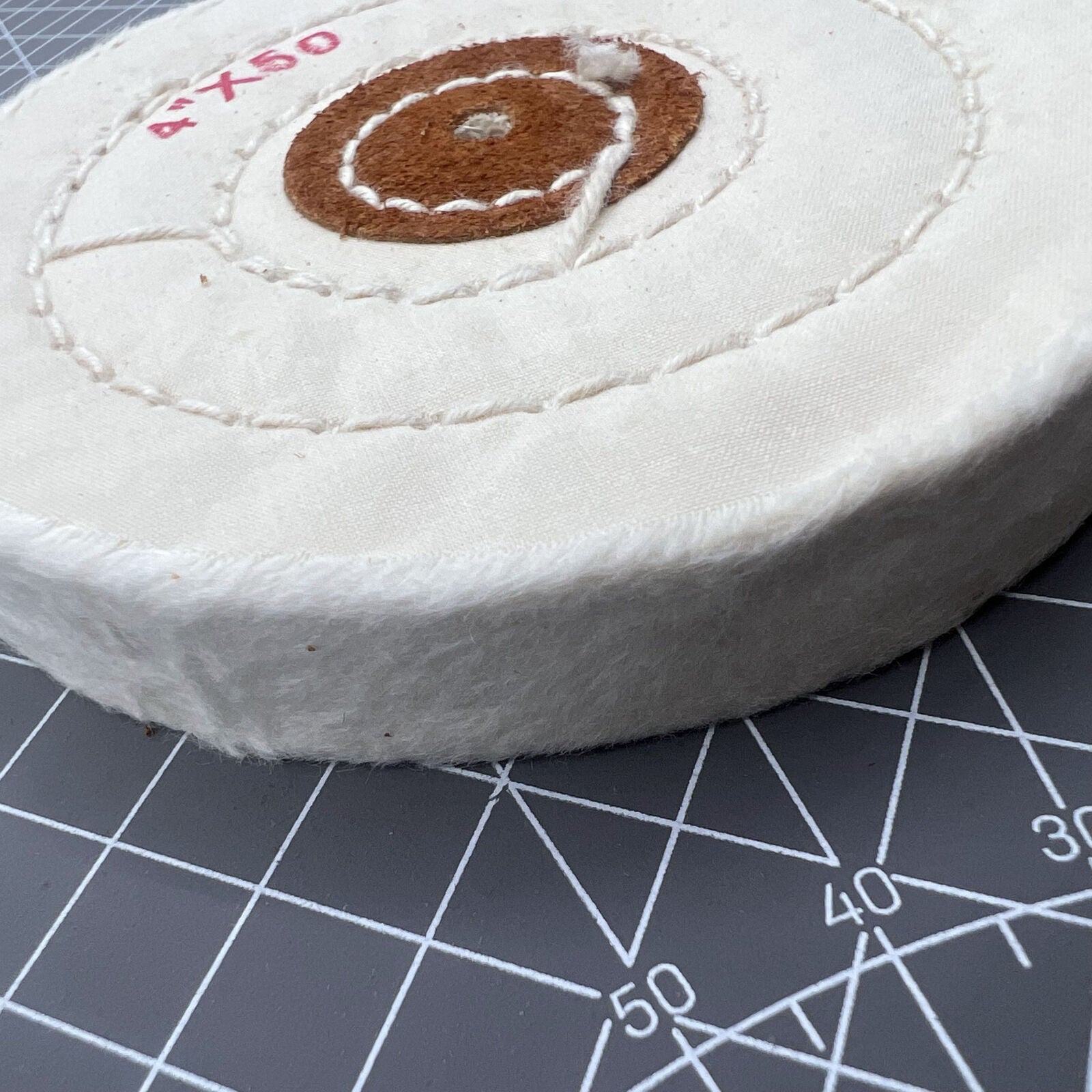 Swiss Made Bergeon 5175-100 white polishing buff wheel for precise watch accessory cleaning and finishing.