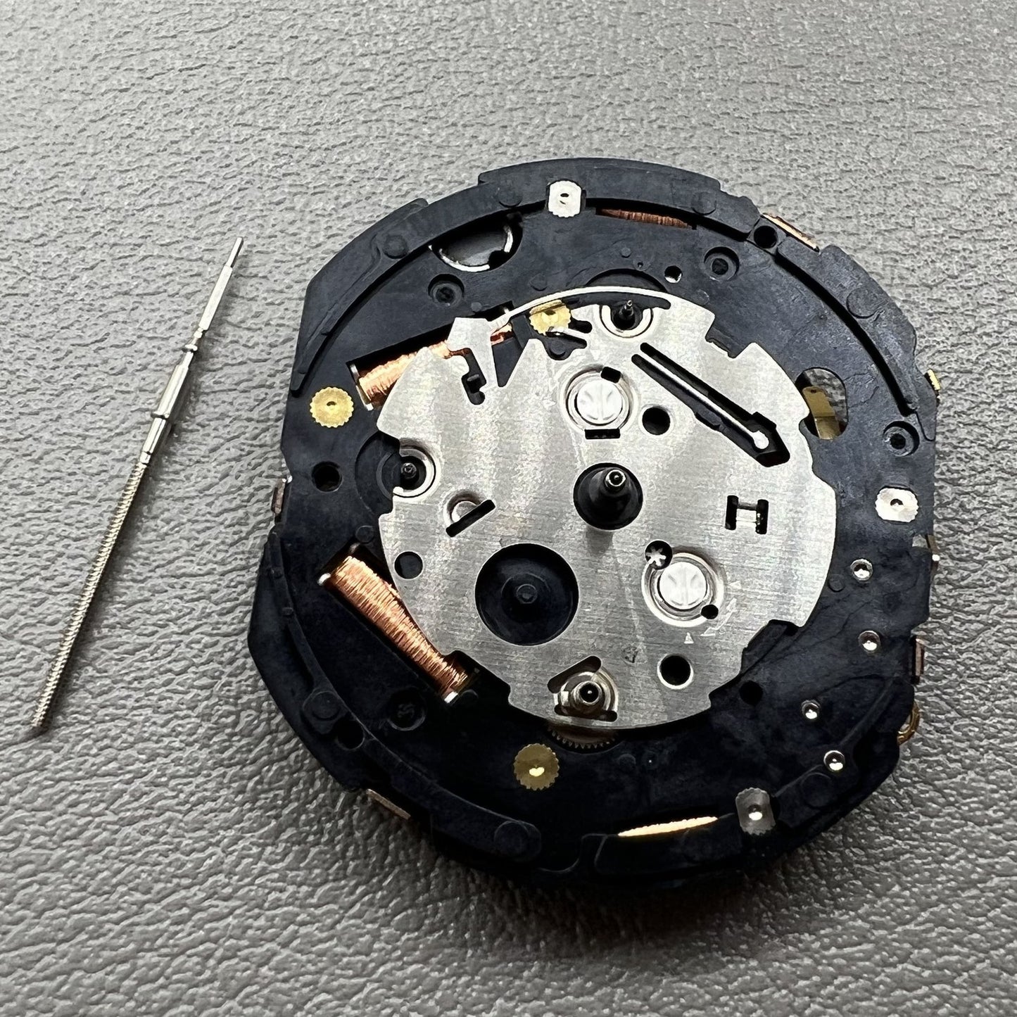 Seiko 7T86A quartz watch movement replacement part, precision Japanese craftsmanship for repairs.