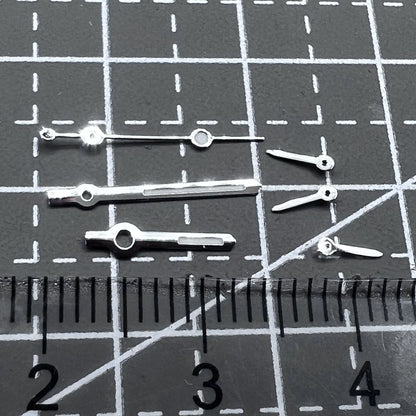 Silver arrow-shaped watch hands with green luminous trim, compatible with VD53 VD54 VD57 movements, 2 sets per pack.